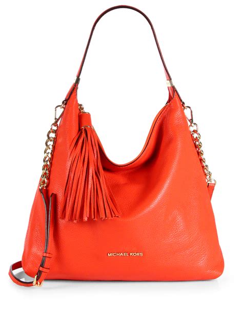 tan michael kors bag orange straps|Michael Kors soho large bag.